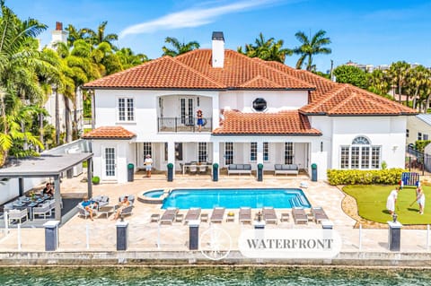 Relish in waterfront tranquility from the heated pool and lounge areas by the private dock.