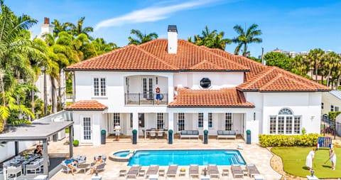 Relish in waterfront tranquility from the heated pool and lounge areas by the private dock.