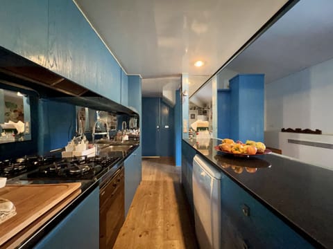 another view of the kitchen with its wide marble countertop