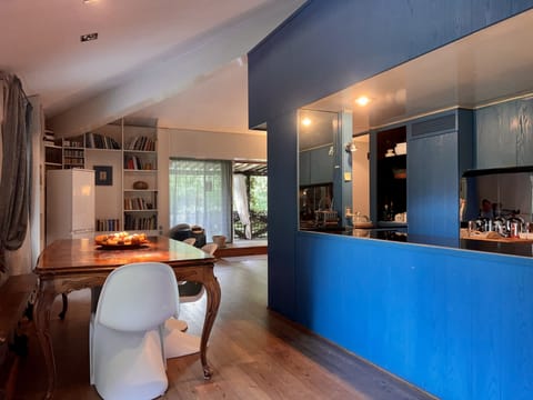 Another view of the dining area where you can also see the kitchen