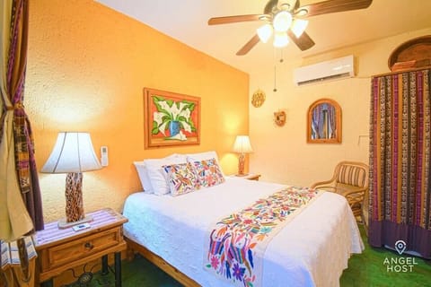 Bright, airy bedroom with a touch of local charm – the perfect retreat.