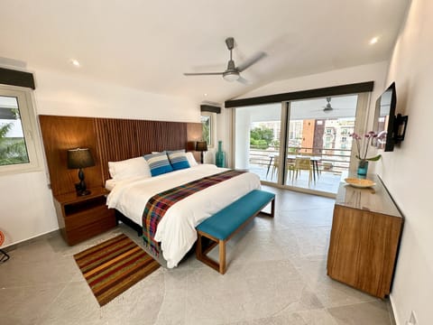 Spacious primary bedroom w/ king-size bed, new mattress, desk & walk-in closet.