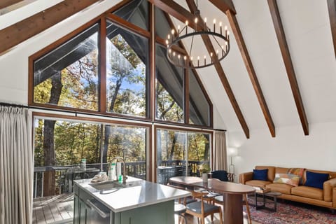 Great Room with a Wall of Glass Doors and Windows Letting in Natural Light