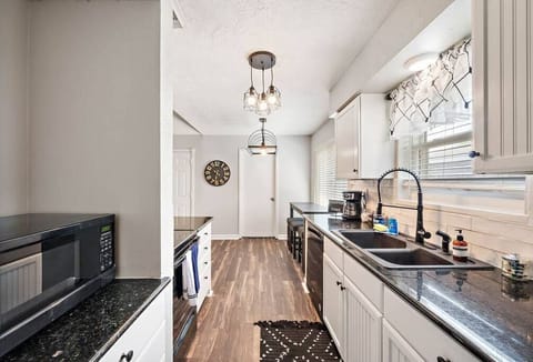 Kitchen: Bright with modern finishes, perfect for culinary adventures and gatherings.