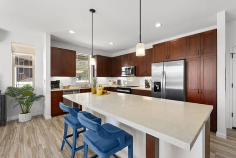 Barstool seating at the kitchen island.