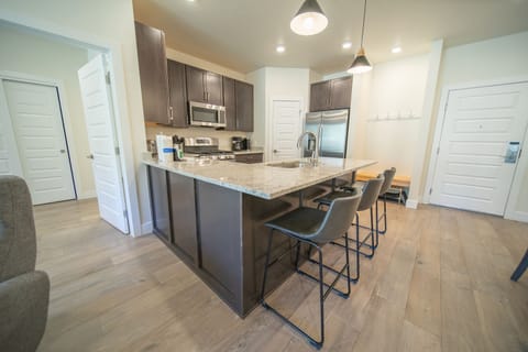 Fully equipped kitchen and doorway to Master bedroom