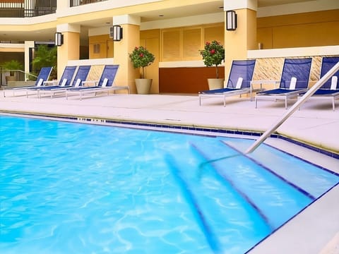 Lounge poolside and soak up warm, breezy sunshine.