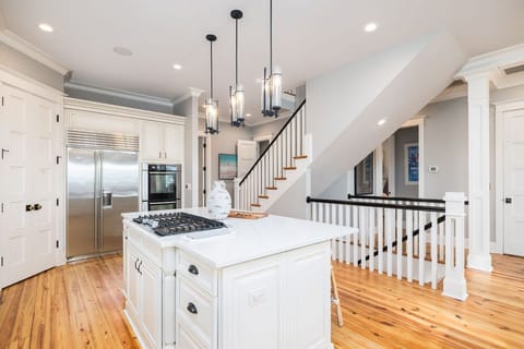 Open-Concept Kitchen and Living Area – Ample counter space and stylish coastal finishes.