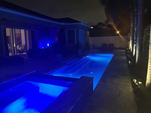 Unwind in the heated saltwater pool and spa with customized wifi pool's color.