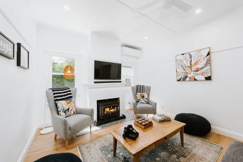 Relax in the living area, where you can cosy up by the fireplace during winter and enjoy some TV, including Netflix for your entertainment.