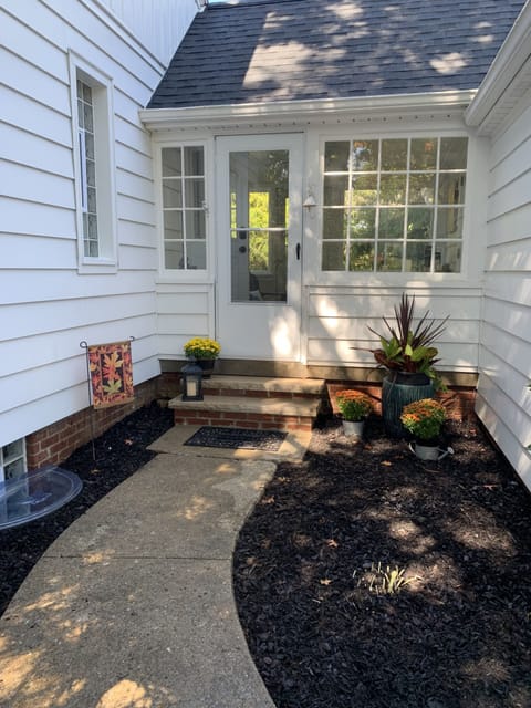 Walkway to the breezeway and entrance into the home