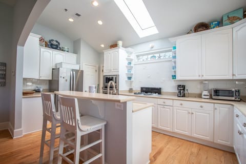 Kitchen, 2nd floor, 2 seats at bar, coffee pot, access to back screened porch