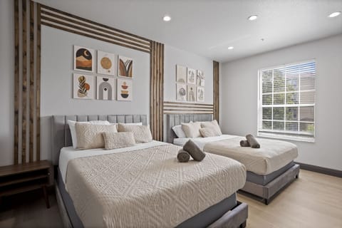 Two queen beds with a private TV and personal nightstands w/  HUGE walk-incloset