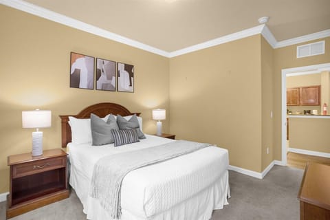 Two master bedrooms, both with nightstands on both sides of the bed and TV!