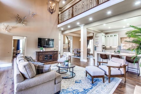 Welcome to Plano! Relax and make memories in this open living room and kitchen.