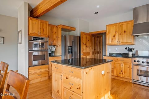 Two Ovens, One inside refridgerator, two garage fridge/freezers