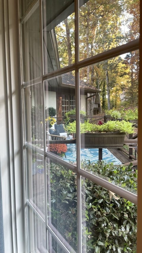 Main floor king bdrm #1 windows overlooking front entry & garden