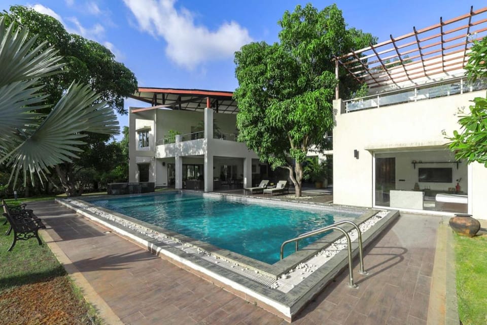 The Leaf by StayVista - An enchanting escape offering a pool, terrace, lush lawn, contemporary interiors, and indoor games Villa in Maharashtra