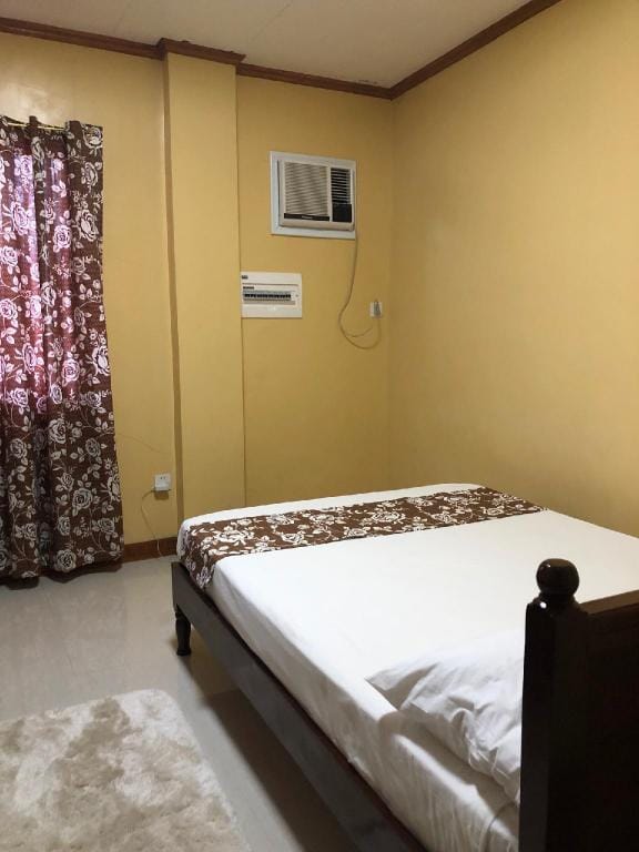 NRR room 3-clean with private bath, A/C, frontview Apartment in Caraga