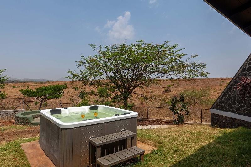 Stone House Bezze by StayVista with Lake view, Jacuzzi & Lawn - your perfect getaway Villa in Maharashtra