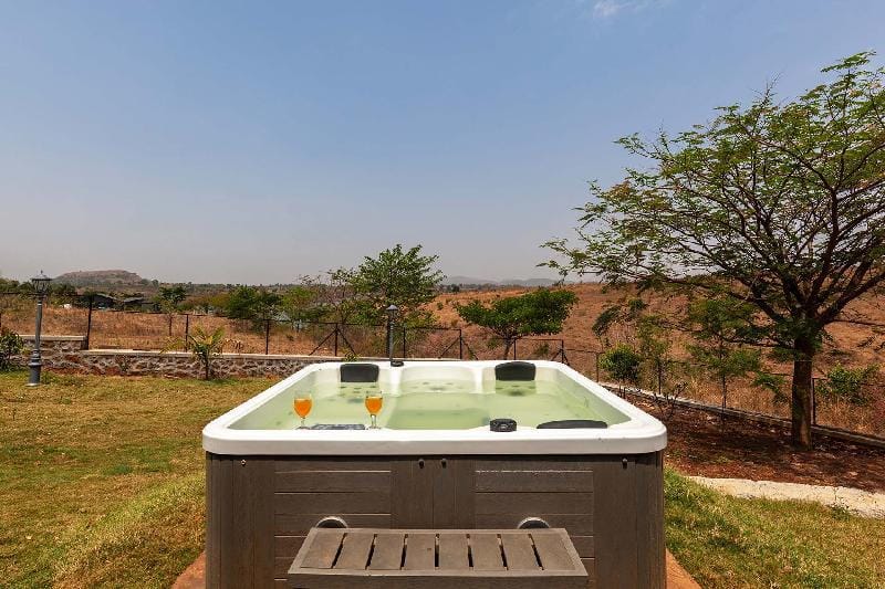 Stone House Bezze by StayVista with Lake view, Jacuzzi & Lawn - your perfect getaway Villa in Maharashtra