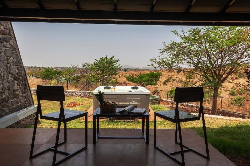 Stone House Bezze by StayVista with Lake view, Jacuzzi & Lawn - your perfect getaway Villa in Maharashtra