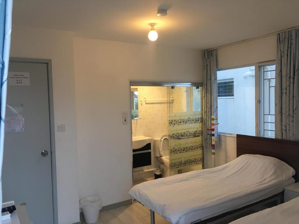 Twin Bed Room with Balcony Apartment in Hong Kong