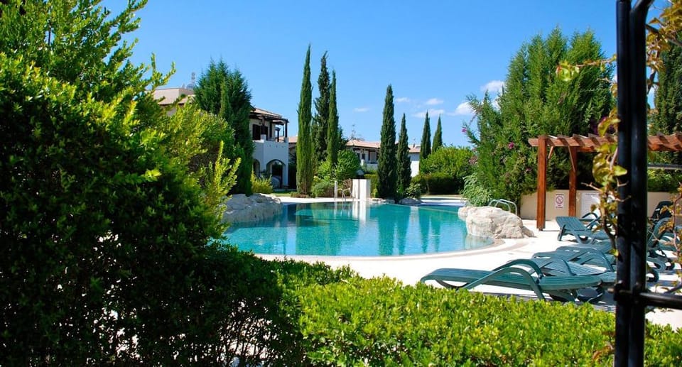 Poolside ground floor apartment 'DC01' - Helios Heights Village on Aphrodite Hills Resort Apartment in Kouklia