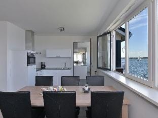 Waterfront penthouse with roof terrace Apartment in Kamperland