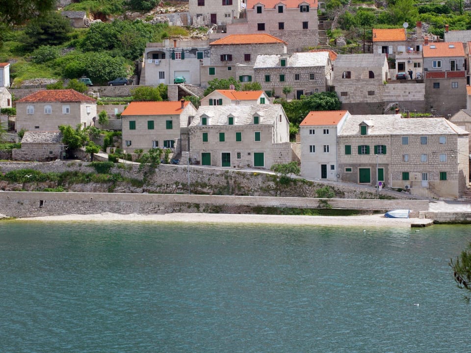 Beautiful holiday home on the island Brac, with the sea and a small beach in front of the door! Vacation rental in Split-Dalmatia County