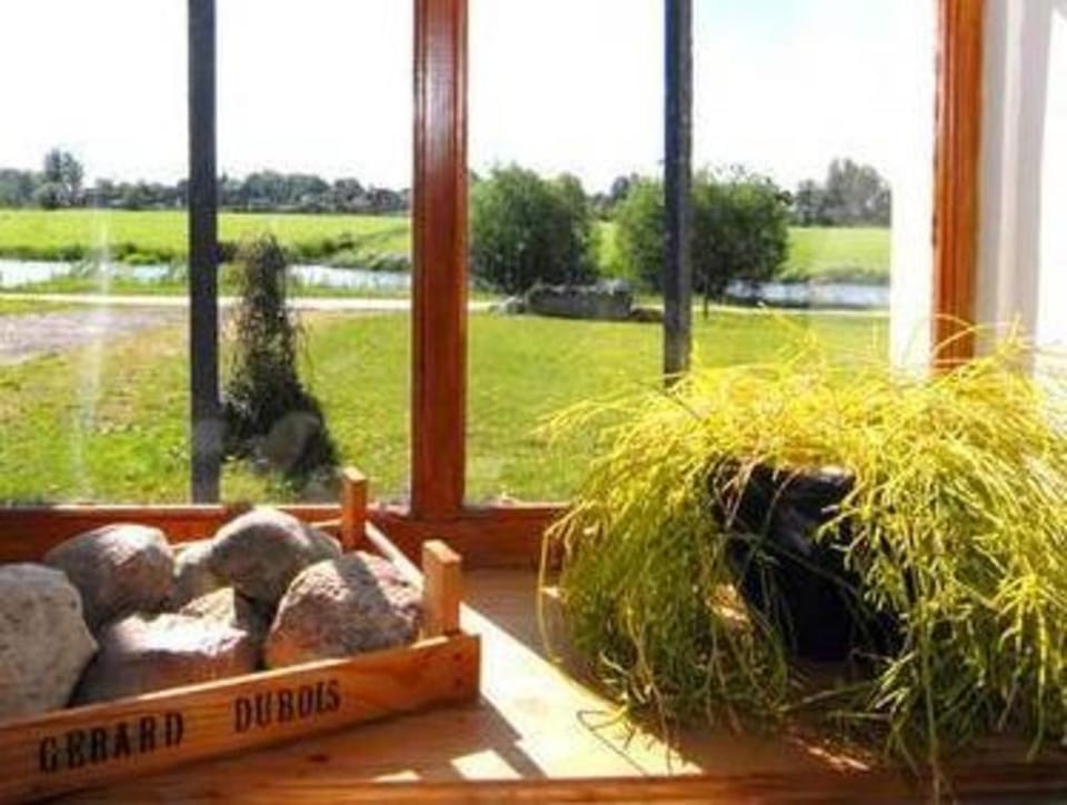 Farmhouse by Lauwers River with Rowing Boat Apartment in Friesland, Netherlands
