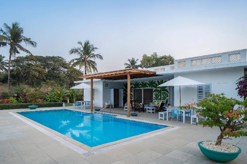 Whispering Palms by StayVista - Pool-view villa with Boutique interiors, Terrace & Lawn Villa in Maharashtra