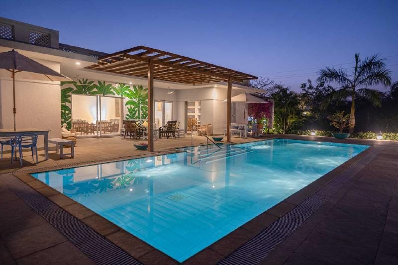 Whispering Palms by StayVista - Pool-view villa with Boutique interiors, Terrace & Lawn Villa in Maharashtra