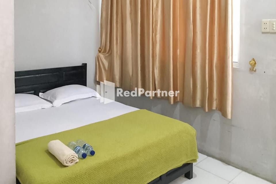 Aquino Marito Homestay Mitra RedDoorz Hotel in Indonesia