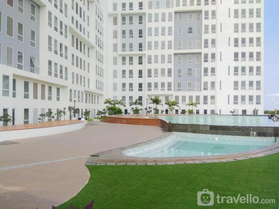 Comfy & Homey 2BR at Patraland Urbano By Travelio Apartment in West Java