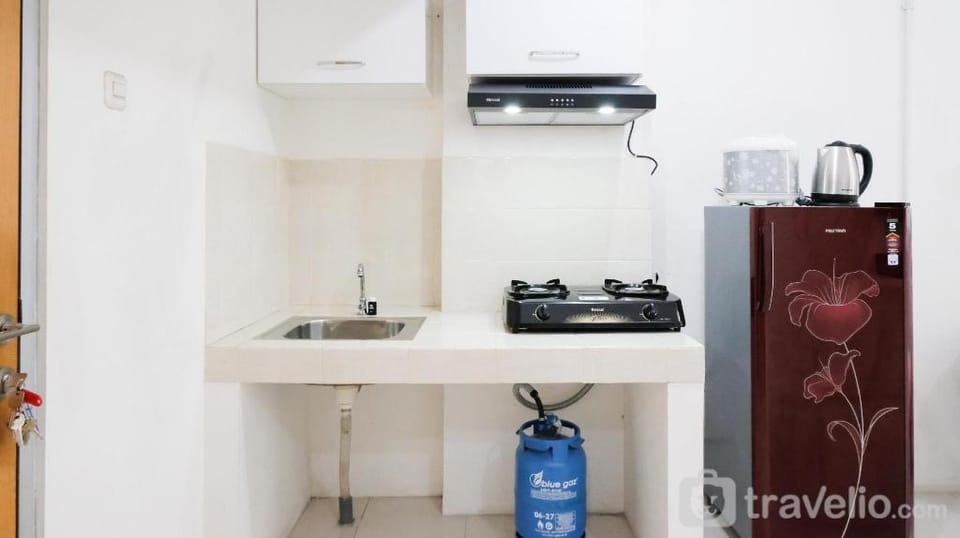 Homey 2BR at Puncak Permai Apartment By Travelio Apartment in Surabaya