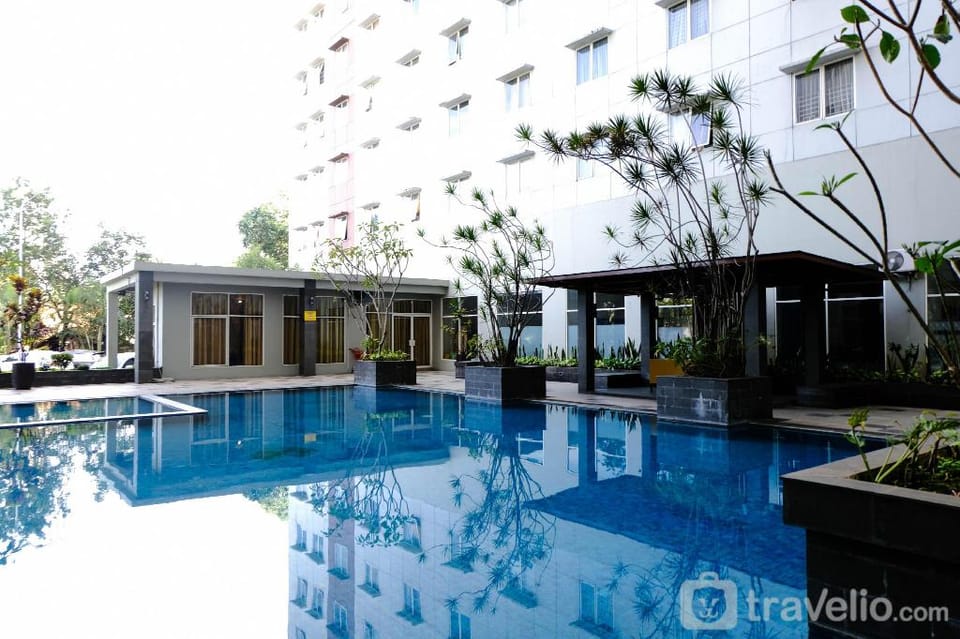 Simply Homey 2BR at 11 Floor Pinewood By Travelio Apartment in West Java
