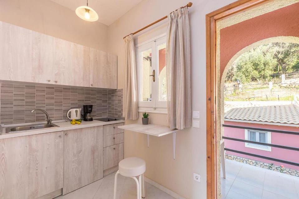 Studio Apartments Paradise with large swimming pool at Pelekas Beach Apartment in Corfu, Greece