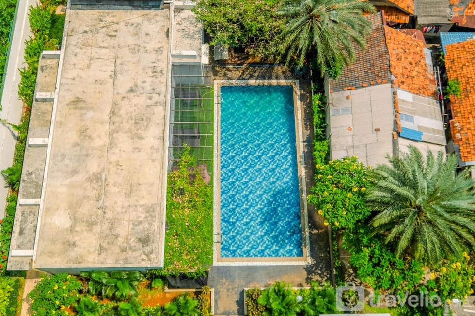 Homey Warm 1BR at Ambassade Residence By Travelio Apartment in South Jakarta City