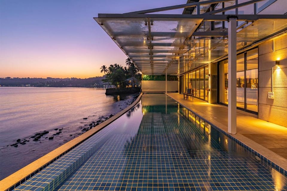 Oceanic Sunsets with River View, Comp Breakfast & Infinity Pool at StayVista Villa in Goa, India