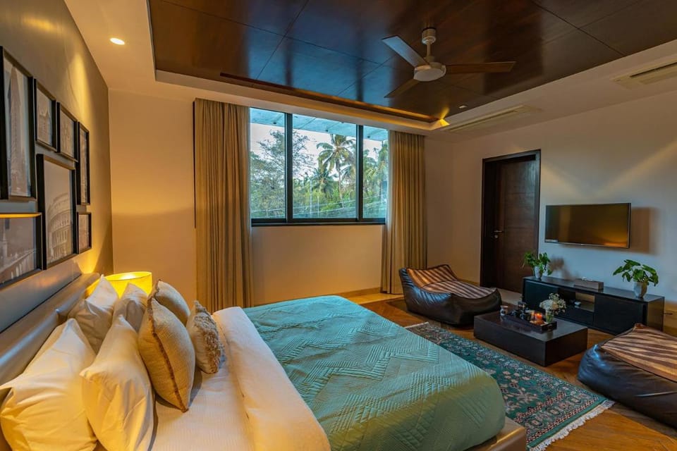 Oceanic Sunsets with River View, Comp Breakfast & Infinity Pool at StayVista Villa in Goa, India