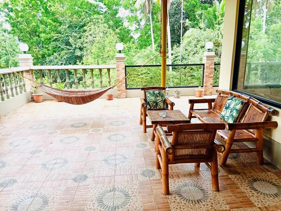 Chateau La Princesa 1  family room  with terrace  Villa in Puerto Princesa