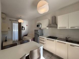 Four-room flat in a beautiful village with swimming pool - By Beahost Rentals Apartment in Bibione