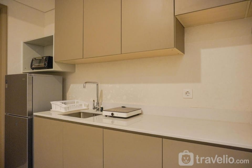 Modern Look and Warm 1BR at Gold Coast By Travelio Apartment in Jakarta
