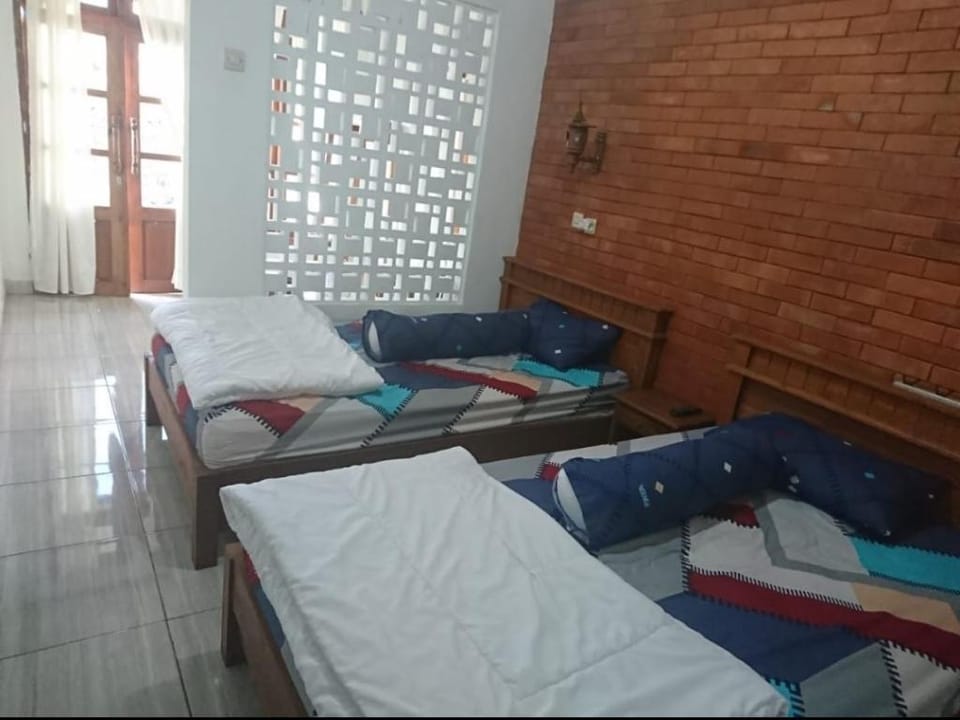 Comfortable bedroom for 3 at Cemara Lawang, Bromo Apartment in East Java