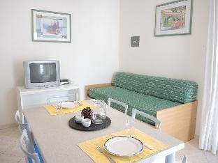 Two-Bedroom flat with balcony and private garden - By Beahost Rentals Apartment in Bibione