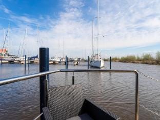 Beautiful houseboat in Marina of Volendam Docked boat in Volendam