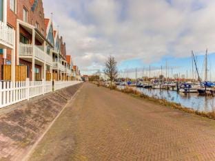 Houseboat in Volendam near Fort Edam Docked boat in Volendam