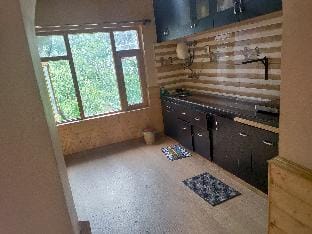CozyNook Manali | Balcony with 360 Mountain Views Villa in Manali