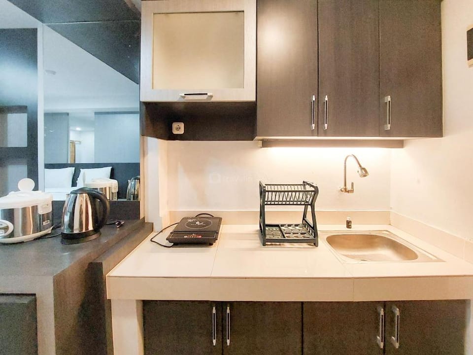 Homey Warm Studio at Mansyur Residence By Travelio Apartment in Indonesia
